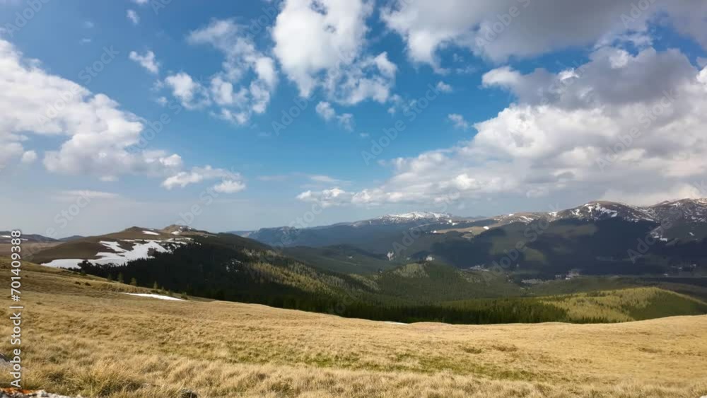 Time lapse of clouds in mountains environment. Clouds moving towards camera in alpine landscape in spring time Time lapse of clouds in mountains environment. Clouds moving towards camera in alpine landscape in spring time