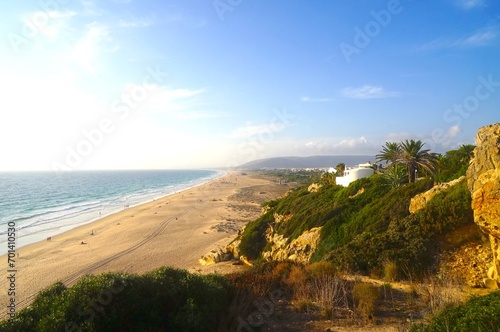 view from a cliff over the beautiful endless sandy beach between Atlanterra  Zahara de los Atunes and Barbate at the Costa de la Luz at the sunset  Andalusia  Spain