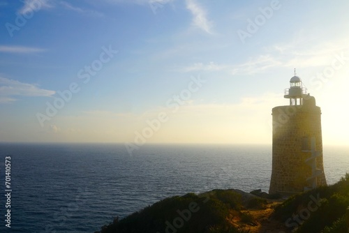 Faro de Camarinal lighthouse near Atlanterra during the sunset with a view towards the Atlantic Ocean, Costa de la Luz, Andalusia, Spain