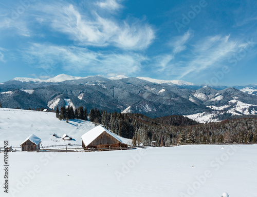 Winter snowy mountains, and lone farmstead © wildman