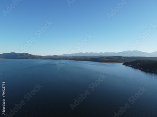 Aerial view of the pristine Iskar reservoir near Sofia, Bulgaria with Balkan mountains in the background