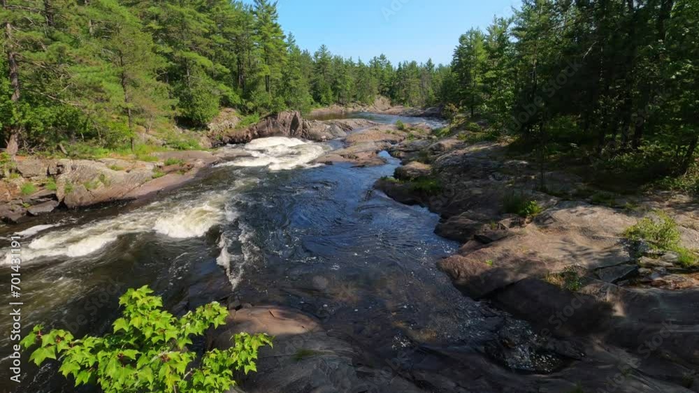 Rapids on river in northern wilderness on sunny day. Rapids on river in northern wilderness on sunny day.