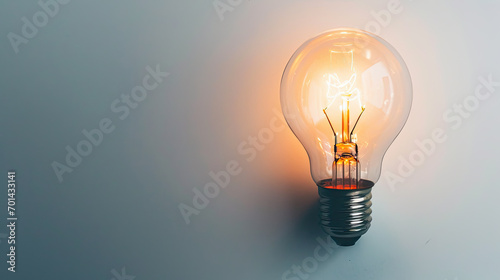Luminous Brilliance: Radiant Light Bulb Illuminates Bright Background. Generative AI
