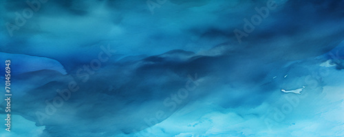 Blue watercolor texture resembles a serene, cloudy sky. 