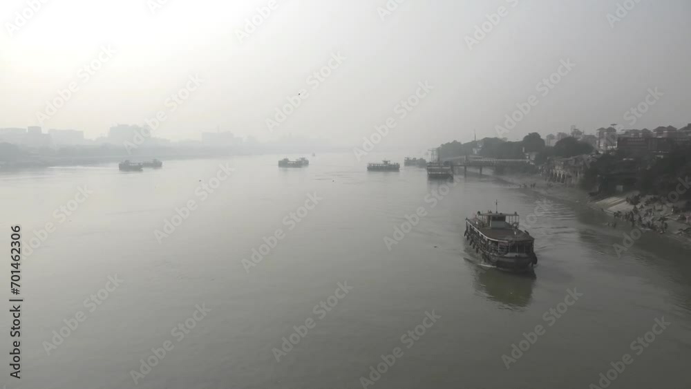 Misty morning view of Hooghly River from Howrah Bridge in Kolkata, West Bengal, India