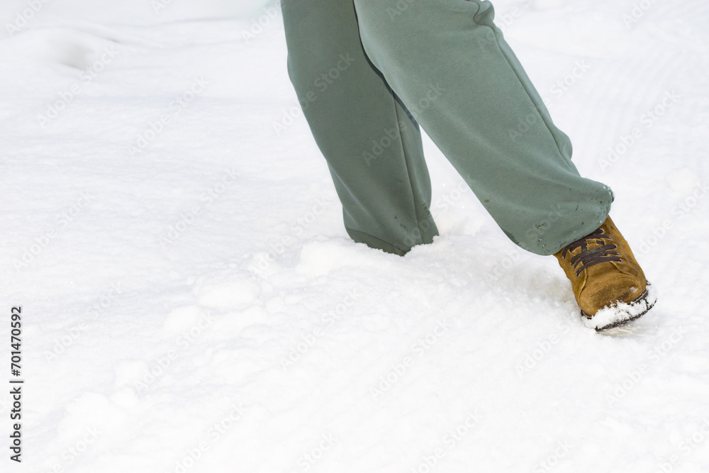 foot in a snowdrift. close-up foot in a snowdrift. close-up