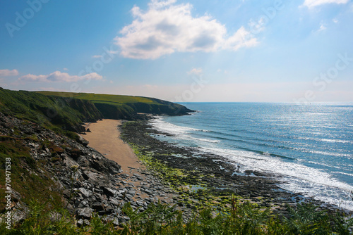 The South-West Coast Path above Porthbeor Beach on the Roseland Peninsula, Cornwall, UK
