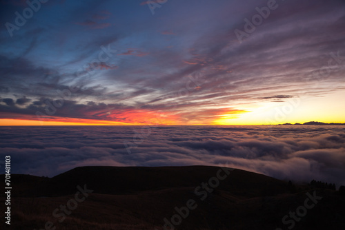 Spectacular sunset over a sea of clouds