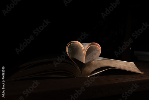 Book pages forming a very romantic heart
