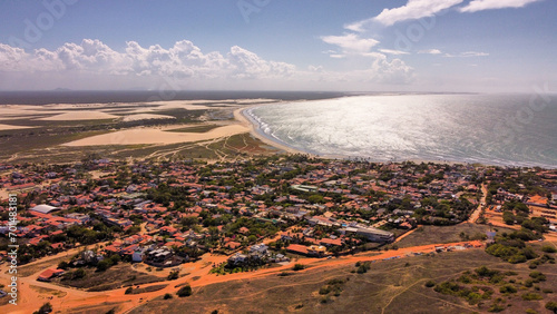 The city of Jericoacoara in Brazil in the middle of sand dunes and ocean front photo