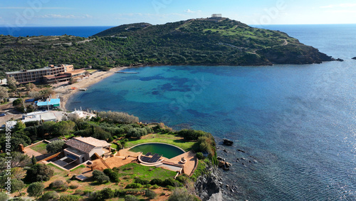 Aerial drone photo of iconic archaeological site of Cape Sounio and famous Temple of Poseidon built uphill overlooking Aegean sea, Attica, Greece