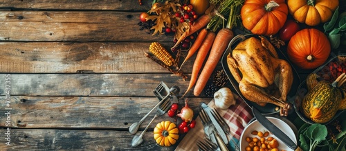 Thanksgiving day dinner table top view Autumn vegetables on plate with cutlery. Creative Banner. Copyspace image