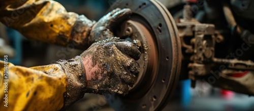 mechanic with dirty hands after fixing the brakes. Creative Banner. Copyspace image photo