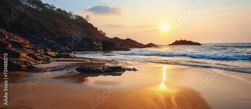 sun at om beach golden light reflecting on sand sunrise at om beach in gokarna Karnataka. Creative Banner. Copyspace image