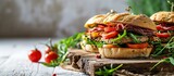 Sandwiches with beef fresh vegetables and herbs on rustic wooden chopping board over white wood backdrop top view horizontal. Creative Banner. Copyspace image