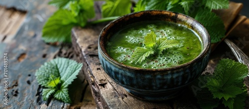 Nettle vegan soup made from young of nettles Green nettle soup. Creative Banner. Copyspace image