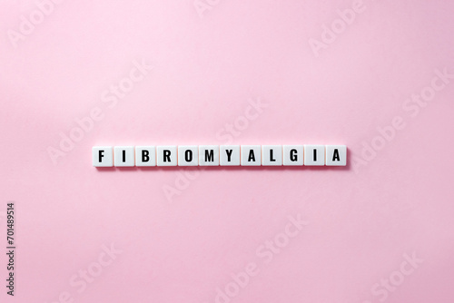 Word fibromyalgia on plastic blocks with letters. Disease concept. Selective focus, copy space photo