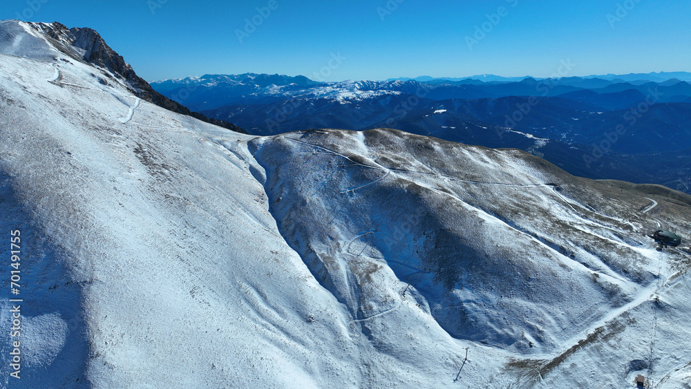 Aerial drone photo of famous ski resort of Velouchi mountain peak as seen at winter, Karpenissi, Evrytania, Greece
