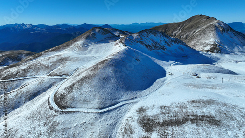 Aerial drone photo of famous ski resort of Velouchi mountain peak as seen at winter, Karpenissi, Evrytania, Greece photo