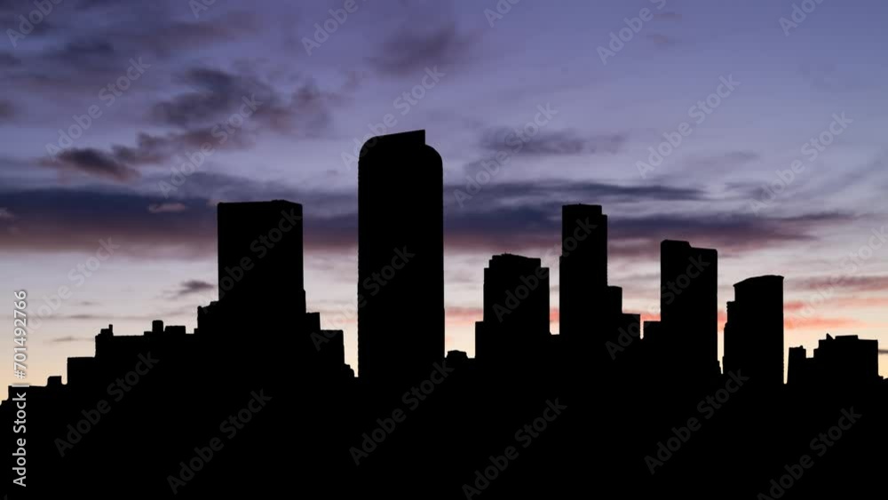 Colorado: View of Denver Skyline at Twilight, Time Lapse with Colourful Clouds and Dark Silhouette of Skyscrapers Colorado: View of Denver Skyline at Twilight, Time Lapse with Colourful Clouds and Dark Silhouette of Skyscrapers