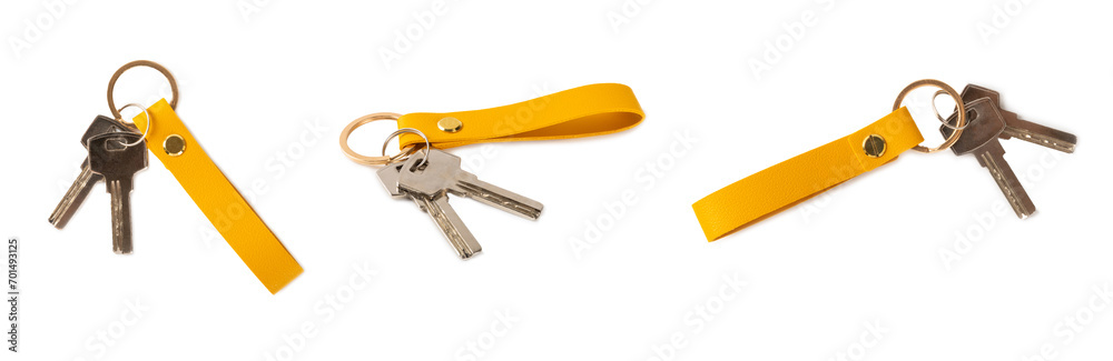 Leather keychain with key ring isolated on white background. Concepts for real estate and moving home or renting property. Buying a property. Mock-up keychain.Copy space. Leather keychain with key ring isolated on white background. Concepts for real estate and moving home or renting property. Buying a property. Mock-up keychain.Copy space.