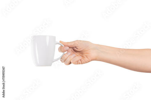 A woman's hand holds a white ceramic cup isolated on transparent png background with clipping paths. Tea or coffee break.