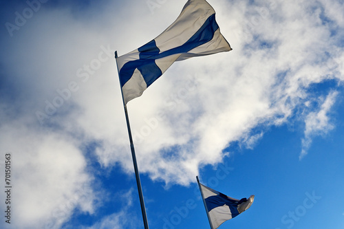 waving national flags of Finland