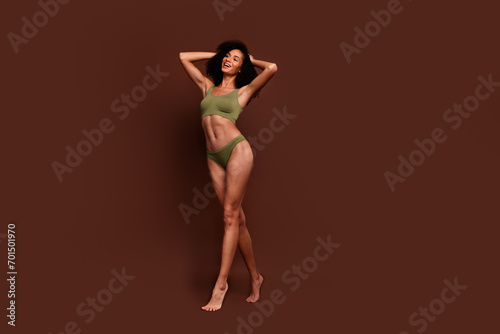 Full length no filter studio photo of shiny pretty woman wear lingerie accepting scars skin empty space isolated brown color background