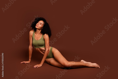 Photo of pretty deamy lady no retouch body sitting floor accept herself stretch marks imperfections isolated on brown color background