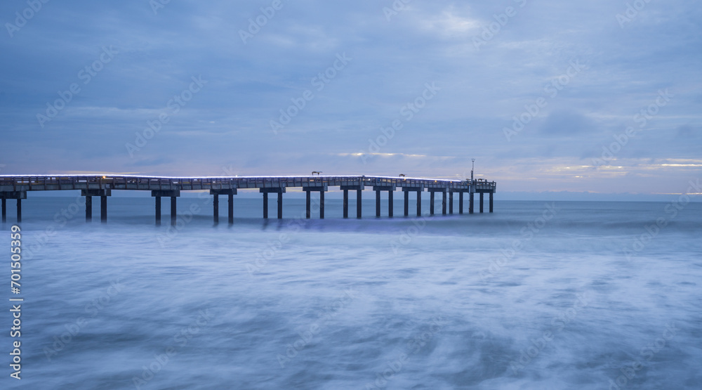 Long exposure of ocean at pier
