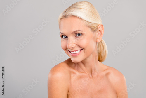 Portrait of attractive lady have morning bath routine apply cream lotion products isolated grey color background