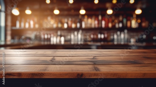  a wooden table top in front of a bar with bottles on the wall and lights hanging from the ceiling in the background.