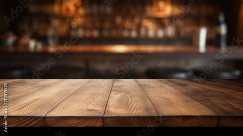  a close up of a wooden table with a blurry image of a bar in the background.