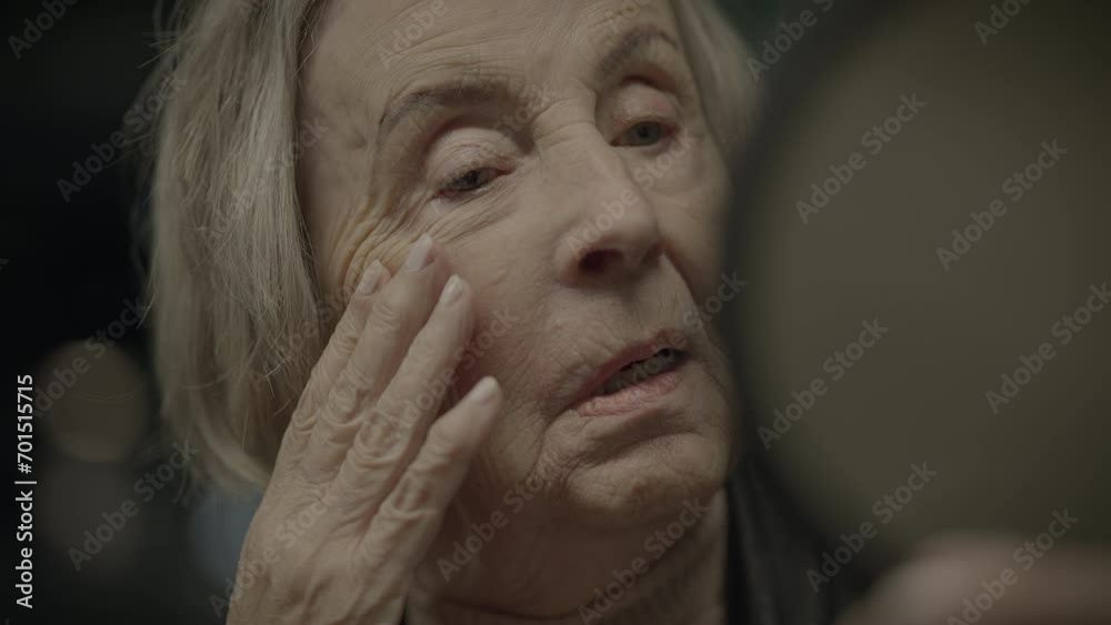 Sad Elderly Woman Watching Herself in Mirror Thinking About the Past Sad Elderly Woman Watching Herself in Mirror Thinking About the Past