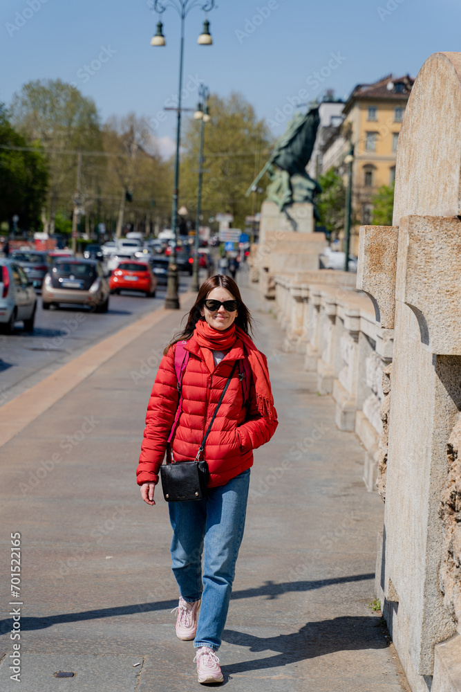 Turin. A girl walks down the street.