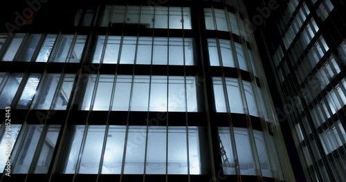 illuminated window of office building at night photo