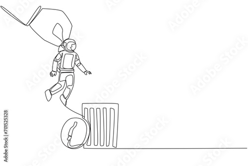 Single continuous line drawing astronaut is lifted by a giant hand will be put into trash can. Destroyer of space expedition mission plans. Cosmonaut outer space. One line design vector illustration