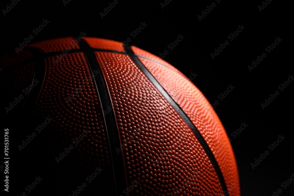 Obraz premium One basketball ball on black background, closeup