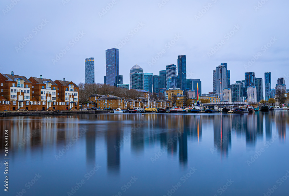 View of skyscrapers in London city as seen from Surrey docks, England View of skyscrapers in London city as seen from Surrey docks, England