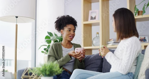 Conversation, coffee cup and living room women, friends or discussion on gossip news, communication or morning drinks. Home sofa, beverage and people talking, speaking and relax with matcha green tea photo