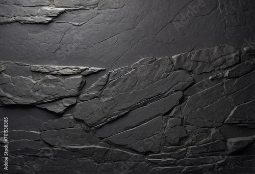 Textured gray stone surface, perfect for backgrounds or design projects requiring a rough stone appearance