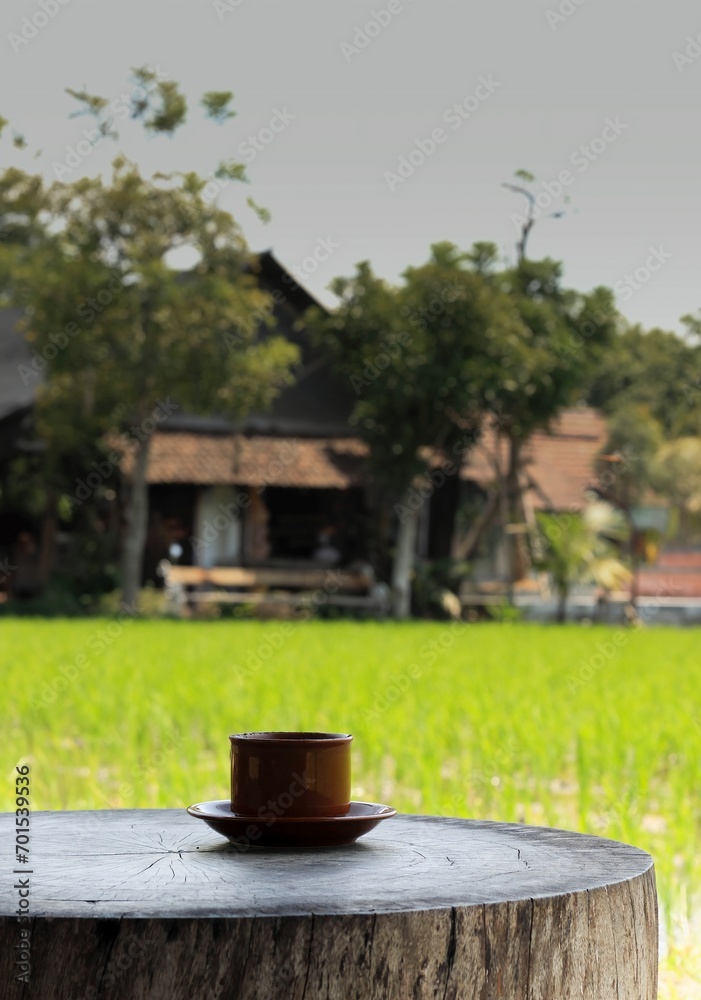 Cup of coffee on table outdoor relaxing on morning light. Cup of coffee on table outdoor relaxing on morning light.