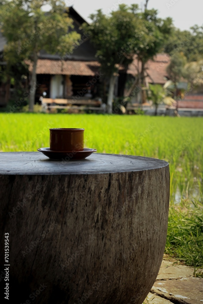 Cup of coffee on table outdoor relaxing on morning light. Cup of coffee on table outdoor relaxing on morning light.