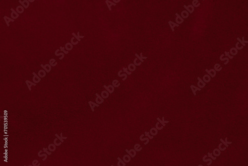 Dark red velvet fabric texture used as background. silk color scarlet fabric background of soft and smooth textile material. crushed velvet .luxury dark tone for silk.