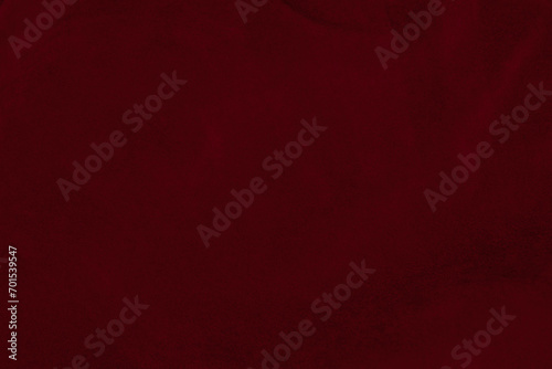 Dark red velvet fabric texture used as background. silk color scarlet fabric background of soft and smooth textile material. crushed velvet .luxury dark tone for silk.