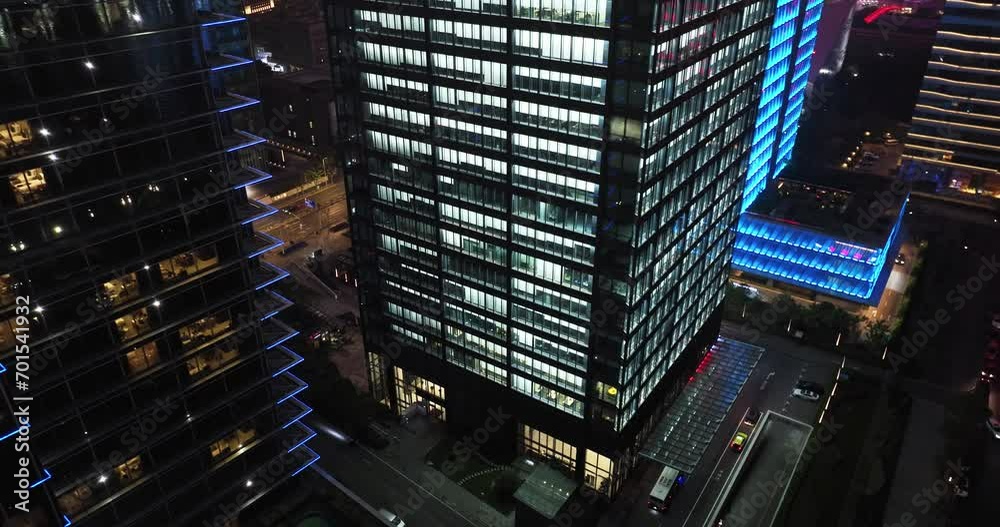 illuminated windows of office building at night