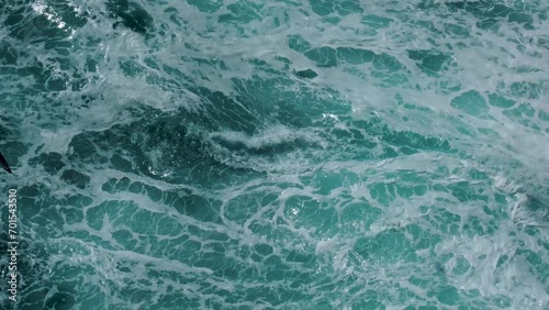 Seabirds flying over the white waves of West Iceland