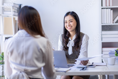 Teamwork meeting  laptop and business people in office workplace. Collaboration  technology and workers  women or employees with touchscreen planning sales  research or financial strategy in company