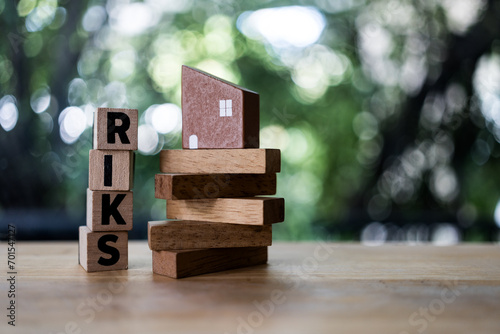 Wood tower block of RISK management with copy space, foreclosure and bankruptcy concept. Real estate property, money risk management in estate