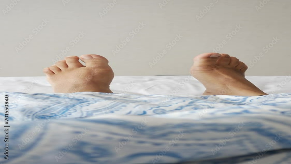 young Woman lying with bare feet in bed, young Woman lying with bare feet in bed,
